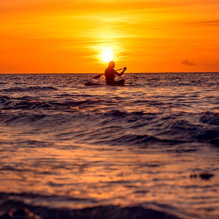 kayaking on lake at sunset