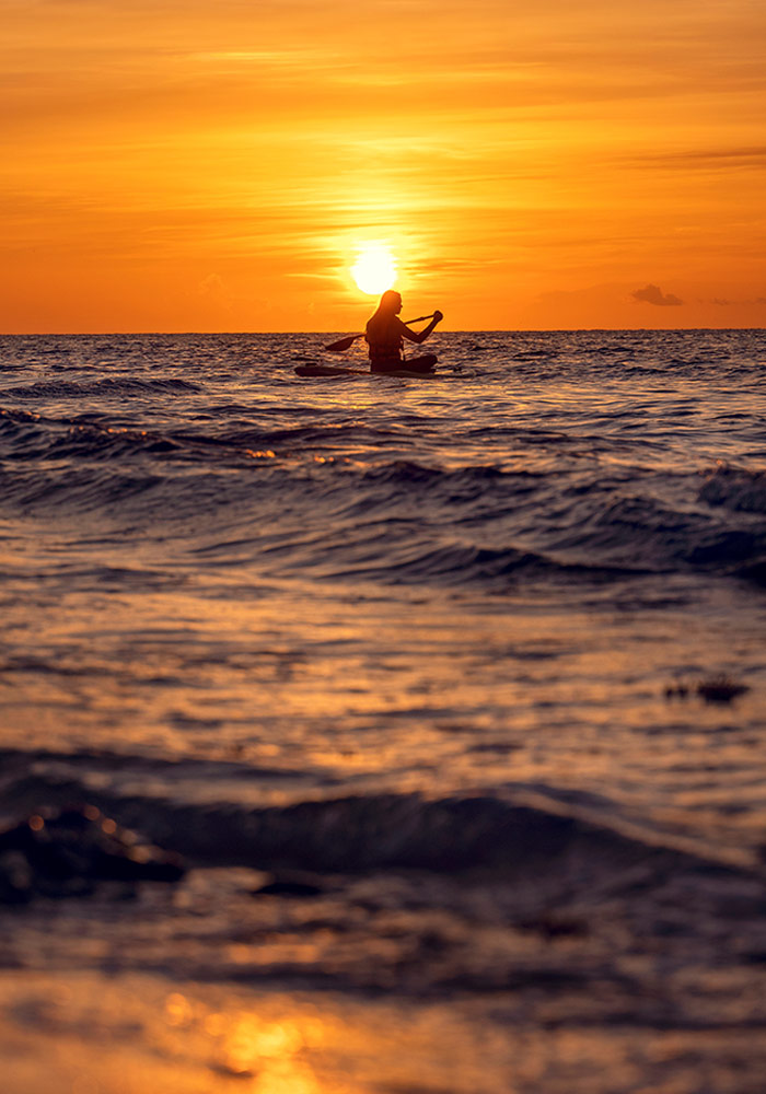 kayaking on lake at sunset