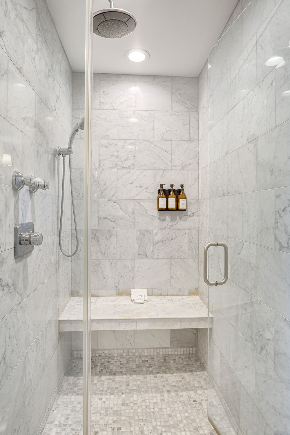 large walk in shower with seating